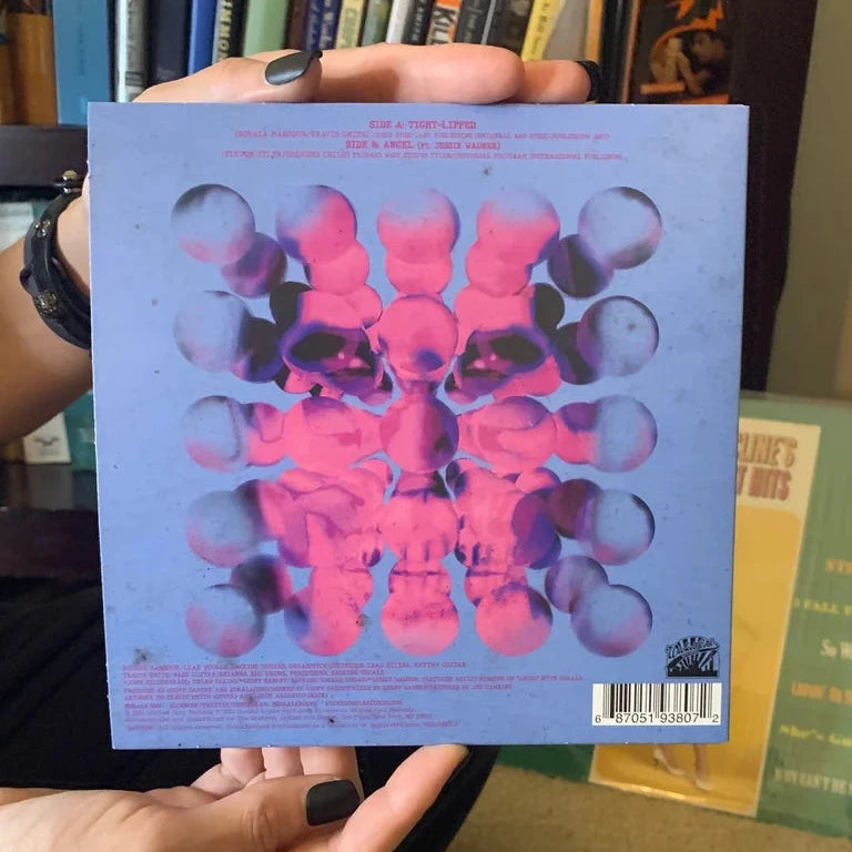 Tight Lipped 7" pink-and-black splatter vinyl single